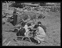 Women wait while their husbands bid at the auction of the farm of Mr. Anthony Yacek. Near Derby, Connecticut. Sourced from the Library of Congress.