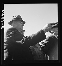 [Untitled photo, possibly related to: Mr. E.S. Beardsley, a typical New England auctioneer. A great talker, he is also active in local politics and in church work. At the auction sale of the farm of Mr. Anthony Yacek. Derby, Connecticut]. Sourced from the Library of Congress.