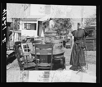 [Untitled photo, possibly related to: Furniture and old dress model auctioned off at the auction of Mr. Anthony Yacek's farm and household goods. Derby, Connecticut]. Sourced from the Library of Congress.