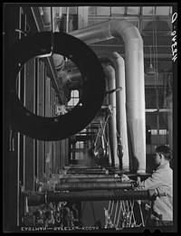 New type of plating machine being used at the Hamilton Standard Propeller Corporation. It automatically dips the part into the proper solutions for the proper lengths of time. East Hartford, Connecticut. Sourced from the Library of Congress.