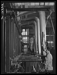 New type of plating machine being used at the Hamilton Standard Propeller Corporation. It automatically dips the part into the proper solutions for the proper length of time. East Hartford, Connecticut. Sourced from the Library of Congress.