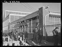 Workmen leaving the plant at the Vought Sikorsky Aircraft Corporation. Stratford, Connecticut. Sourced from the Library of Congress.
