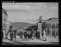 Employees leaving the Denomah Mills in Taftville, Connecticut, at the end of the afternoon shift. Sourced from the Library of Congress.