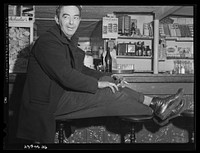 [Untitled photo, possibly related to: Shipyard worker in for a "beer" after work. A bar just outside the Bath Iron Works, Bath, Maine]. Sourced from the Library of Congress.