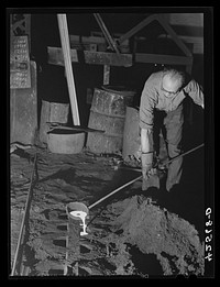 A sample of the steel in the furnace taken out as a test. Farrel-Birmingham Corporation. Ansonia, Connecticut. Sourced from the Library of Congress.