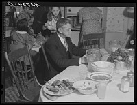 Mr. Timothy Levy Crouch, a Rogerine Quaker, living in Ledyard, Connecticut, finishing up his Thanksgiving dinner. Mr. Crouch is a stonemason by profession and lives on his farm where a little farming is done. Sourced from the Library of Congress.