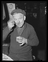 [Untitled photo, possibly related to: Metal workers having lunch at the Correct Manufacturing Company in Fallston, Pennsylvania]. Sourced from the Library of Congress.