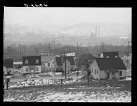 [Untitled photo, possibly related to: Houses in Baden, Pennsylvania. In the background is the Jones and Laughlin Steel Plant across the river in Aliquippa]. Sourced from the Library of Congress.