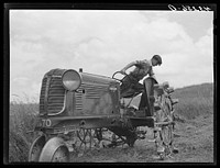 Adjusting mower on farm near Rockville, Maryland. Sourced from the Library of Congress.