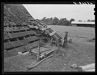 Scattered implements in barnyard on farm near Rockville, Maryland. Sourced from the Library of Congress.