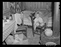 In the second story of a tobacco barn used as living quarters by family of workers from Fort Bragg, North Carolina. Near Fayetteville, North Carolina. Sourced from the Library of Congress.