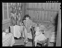 In the second story of tobacco barn used as living quarters by family of workers from Fort Bragg, North Carolina, near Fayetteville, North Carolina. Sourced from the Library of Congress.