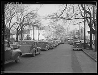 A street in Fayetteville, North Carolina about 4:30 p.m. when workers are coming out of Fort Bragg, North Carolina. Sourced from the Library of Congress.