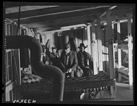 [Untitled photo, possibly related to: A bunk house for thirty or forty men built by a filling station proprietor behind his store. It has upper and lower bunks. Near Silver Lake, North Carolina]. Sourced from the Library of Congress.