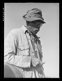 [Untitled photo, possibly related to: Mr. L. A. Anderson, who owned a few acres of land in the Camp Croft area.  Although almost totally blind, he was repairing an old house to move into temporarily. Near Whitestone, South Carolina]. Sourced from the Library of Congress.