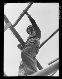 [Untitled photo, possibly related to: Tearing down a house to be moved out of the Santee Cooper basin near Bonneau, South Carolina]. Sourced from the Library of Congress.