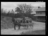 [Untitled photo, possibly related to: Tenant farmer moving the last load of his belongings out of the Camp Croft area near Pacolet, South Carolina]. Sourced from the Library of Congress.