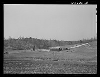 [Untitled photo, possibly related to: This road is the Camp Croft boundary. The family who lived in the house at the left is moving into the barn on the right]. Sourced from the Library of Congress.