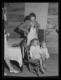[Untitled photo, possibly related to: FSA (Farm Security Administration) borrower and tenant with one of her children. Heard County, Georgia]. Sourced from the Library of Congress.
