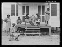  family and friends at one of the prefabricated houses for Negroes at Hazlehurst Farms Inc., Hazlehurst, Georgia. Sourced from the Library of Congress.