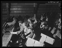 School teachers in Centralhatchee, Georgia, have organized movies in the school auditorium for those who can't get to town. Heard County, Georgia. Sourced from the Library of Congress.