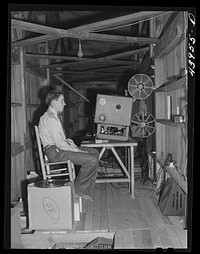 Projecting movies in the school auditorium in Centralhatchee, Georgia, for those who can't get to town. Heard County, Georgia. Sourced from the Library of Congress.