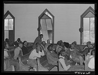 At a meeting of  FSA (Farm Security Administration) borrowers in a church near Woodville, Greene County, Georgia. Sourced from the Library of Congress.
