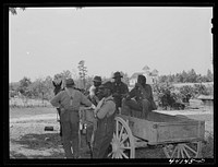 [Untitled photo, possibly related to: Waiting for FSA (Farm Security Administration) meeting of  borrowers to begin. Near Woodville, Greene County, Georgia]. Sourced from the Library of Congress.