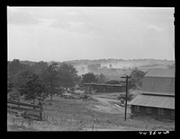 [Untitled photo, possibly related to: Landscape near one of the entrances to the powder plant near Childersburg. The dust in the back ground in caused by a great stream of traffic coming out of the powder plant. Alabama]. Sourced from the Library of Congress.