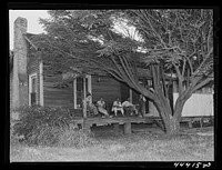 Waiting for dinner at a boarding house in Childersburg, Alabama. Sourced from the Library of Congress.