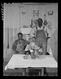 In the home of a FSA (Farm Security Administration) family. Greene County, Georgia. Sourced from the Library of Congress.