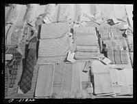 A display of handwoven materials at the Virginia craft co-op on U. S. Highway No. 1, about twenty miles north of Fredericksburg, Virginia. Sourced from the Library of Congress.