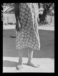 [Untitled photo, possibly related to: Feet of a  farm woman, who together with two children runs a rented farm. Near Woodville, Greene County Georgia]. Sourced from the Library of Congress.