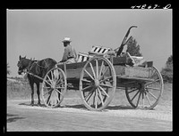  farmer carting some of his farm equipment out of the area that is being taken over by the Army. Caroline County, Virginia. Sourced from the Library of Congress.