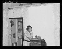 This young woman and her family moved from the area taken over by the Army to a prefabricated house built by FSA (Farm Security Administration) to take care of some of the farmers who had to move. Milford, Caroline County, Virginia. Sourced from the Library of Congress.