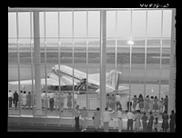 [Untitled photo, possibly related to: Visitors watching one of the airliners on the field. Municipal airport, Washington, D.C.]. Sourced from the Library of Congress.