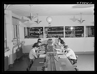 In the ticket reservations department of one of the airliners. Washington, D.C. municipal airport. Sourced from the Library of Congress.