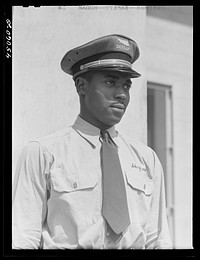 [Untitled photo, possibly related to: "Skycaps" at the entrance to the administration building. Municipal airport, Washington, D.C.]. Sourced from the Library of Congress.