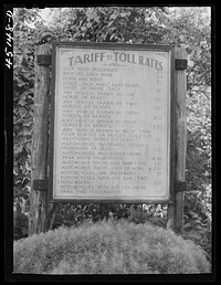 Toll rate sign on the New Hampshire side of a bridge across the Connecticut River near Springfield, Vermont. Sourced from the Library of Congress.