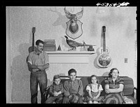 The family of Gottlieb Zahler in their new farm in Lacona, New York, to which they moved from the Pine camp relocation area. In their new home in Lacona, New York. Sourced from the Library of Congress.