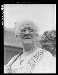 Mrs. Carrie E. Loadwick, lifelong resident of area being taken over by the Army, who is moving to the town of Adams. Leraysville, New York. Sourced from the Library of Congress.