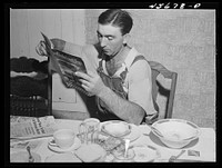 William Gaynor gets several farm journals at his home near Fairfield, Vermont. Sourced from the Library of Congress.