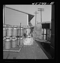 [Untitled photo, possibly related to: Dumping ice into a milk truck at the United Farmers' Cooperative Creamery]. Sourced from the Library of Congress.