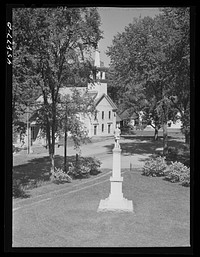 [Untitled photo, possibly related to: Tunbridge, Vermont. Monument and a church]. Sourced from the Library of Congress.