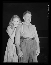 Mr. Albert Brissant and his niece who are still living in the Pine Camp relocation area near Evans Mills, New York. They had an antique shop here which they have sold out and are now looking for a new farm. Sourced from the Library of Congress.