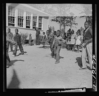 [Untitled photo, possibly related to: Boyd Jones playing dodge ball during recess at the Alexander Community School, Greene County, Georgia]. Sourced from the Library of Congress.