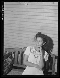 Manati, Puerto Rico (vicinity). Wife of a foreman of a sugar plantation in her home. Sourced from the Library of Congress.