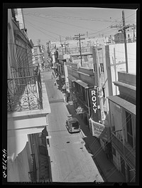 [Untitled photo, possibly related to: San Juan, Puerto Rico. A street in the shopping district]. Sourced from the Library of Congress.