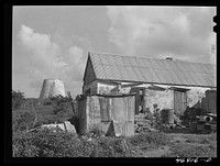 Christiansted (vicinity), Saint Croix Island, Virgin Island. Village house and abandoned sugar tower. Sourced from the Library of Congress.