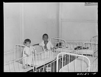 Frederiksted, Saint Croix, Virgin Islands. Child on the left, in the children's ward of the Frederiksted hospital, is suffering from severe malnutrition. Sourced from the Library of Congress.